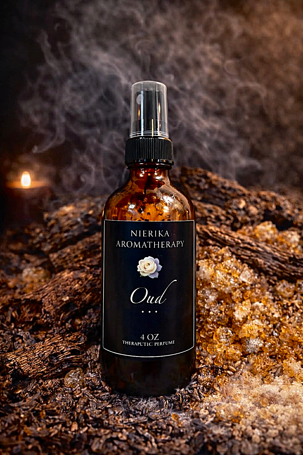 Oud therapeutic perfume spray by Nierika Aromatherapy, pure oud aroma, bottle surrounded by oud wood chips and resin – 4 oz
